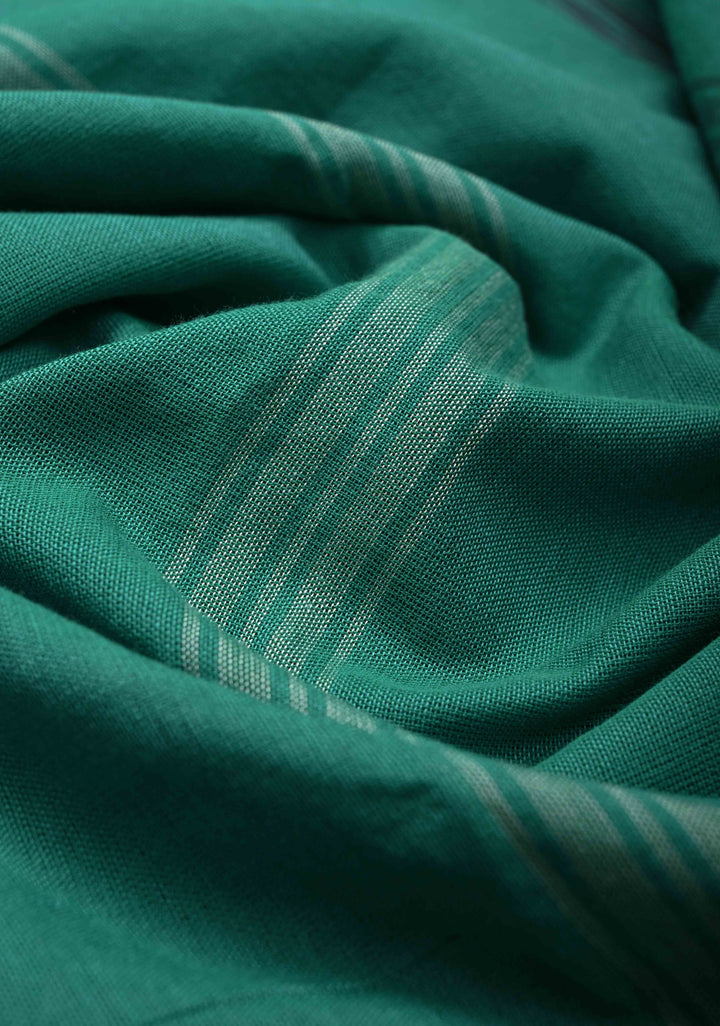 Green Handloom Bhujodi Kala Cotton Saree with buttas and honeycomb tassels
