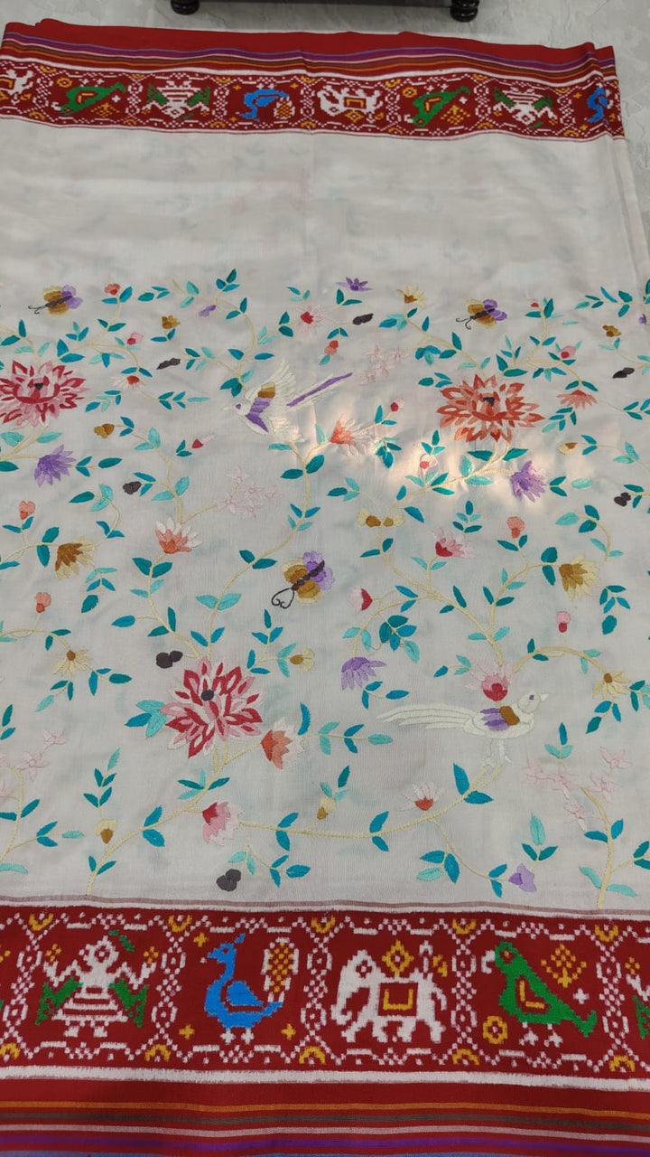 Authentic Double Ikkat Patan Patola Handwoven Silk Saree in white with handmade Parsi Gara embroidery Jugalbandi  | SILK MARK CERTIFIED