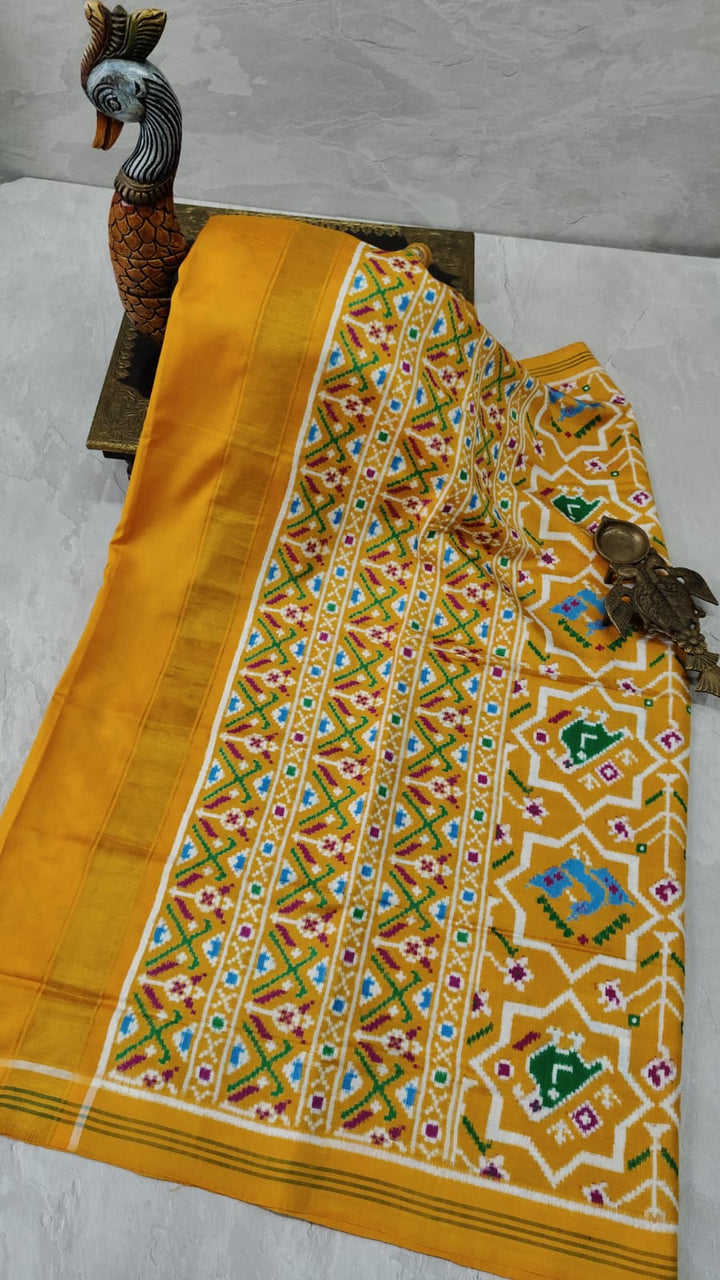Authentic Double Ikkat Patan Patola Handwoven Saree in mustard Yellow with intricate motifs | SILK MARK CERTIFIED