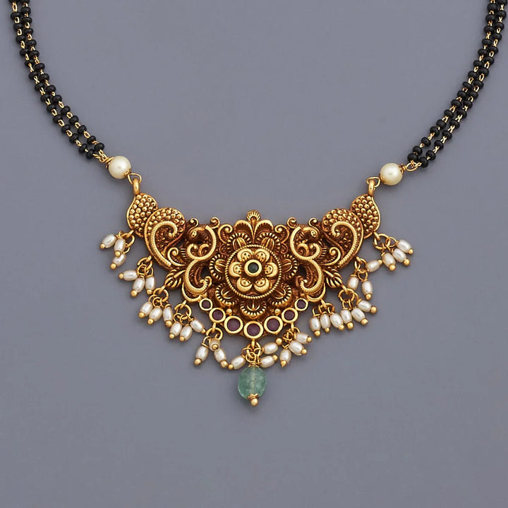 Traditional Gold-Tone Black Bead Mangalsutra with Intricate Flower Design and Pearl, Green Stone Accents