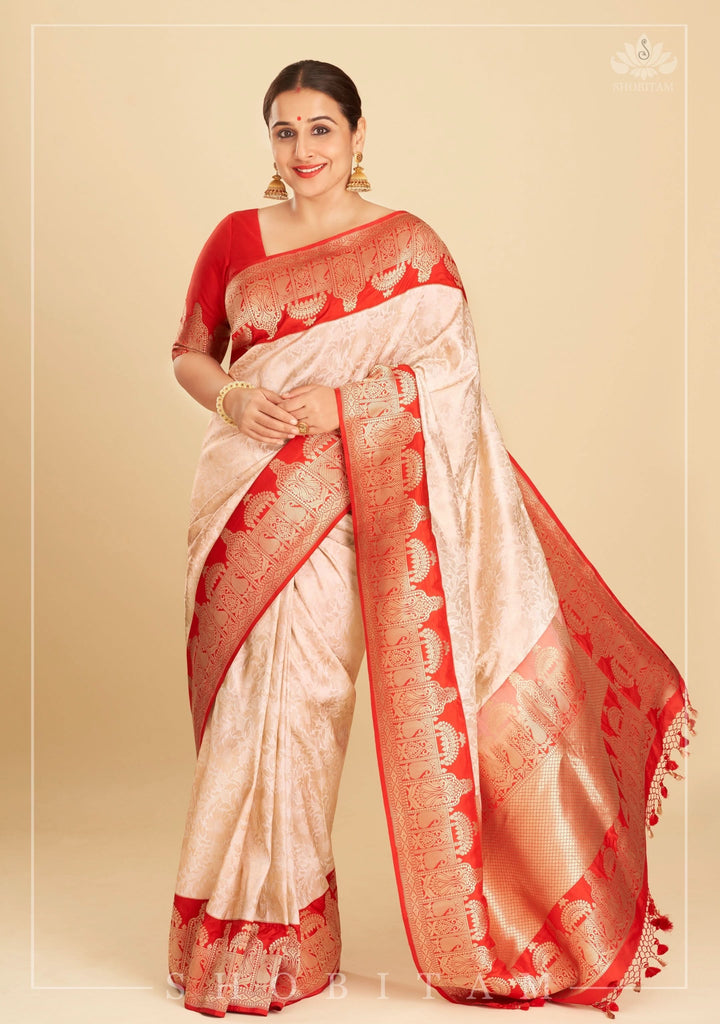 Exquisite Celebrity Brocade Banarasi Pure Katan Silk Saree in Ivory, Red & Gold with Dome Shaped Kadhiyal Borders, Grand Pallu and Zari | SILK MARK CERTIFIED