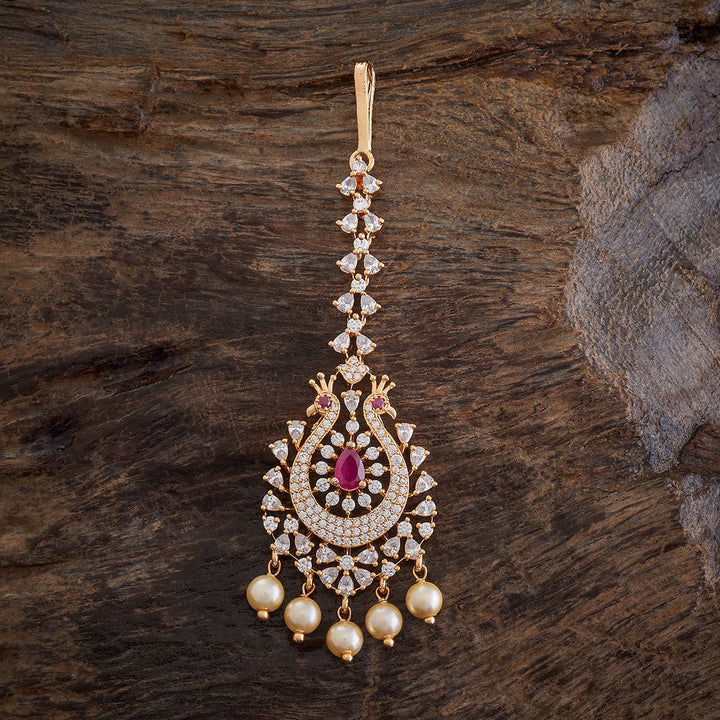 Flower Motif Handcrafted gold-polished Tikka embellished with synthetic stones and beads in Ruby