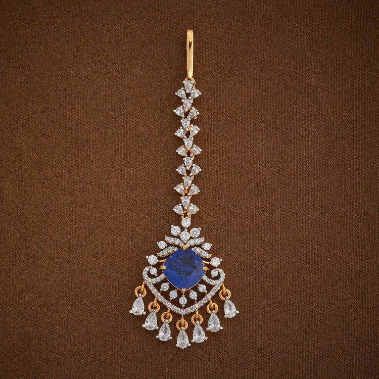 Handcrafted Maang Tikka embellished with synthetic stones in White and Sapphire