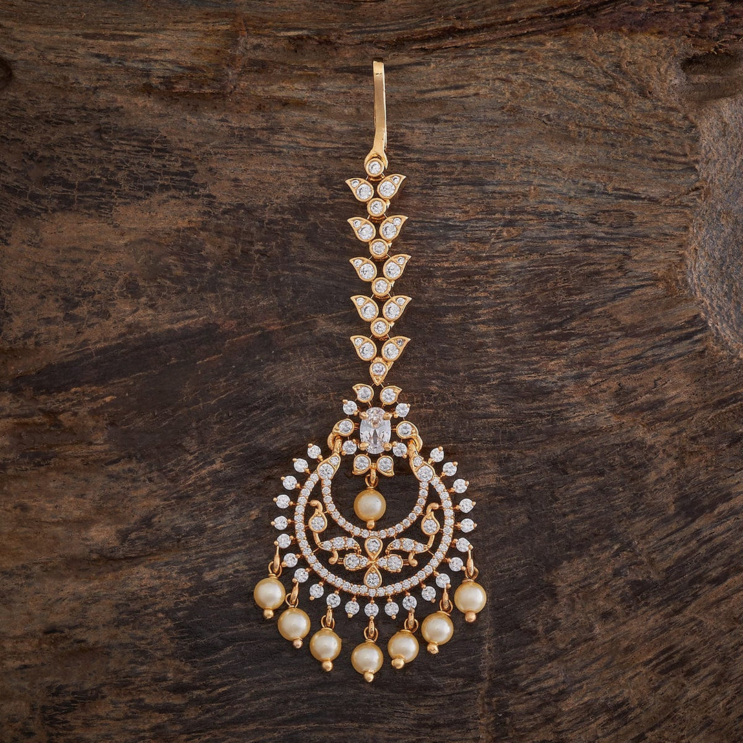 Flower Motif Handcrafted gold-polished Tikka embellished with synthetic stones and beads in White