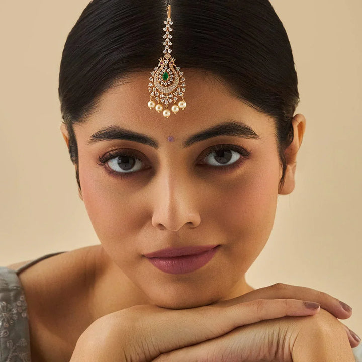 Flower Motif Handcrafted gold-polished Tikka embellished with synthetic stones and beads in Green
