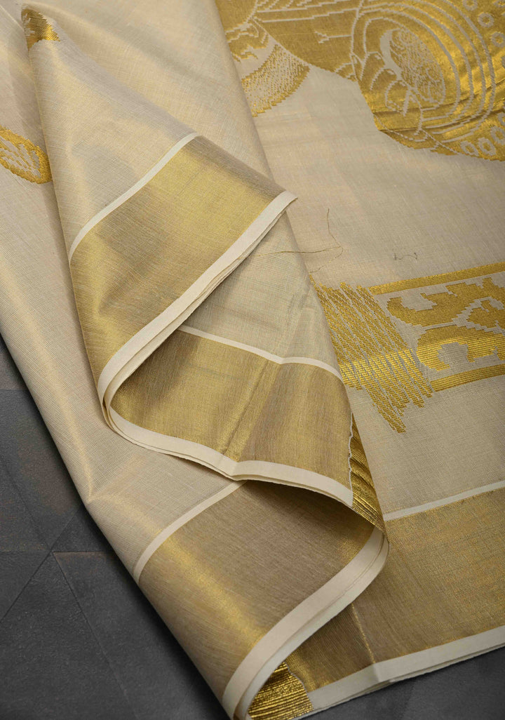 Unique Kerala Kasavu Saree in Tissue Cotton with Zari Buttas and Baby Krishna Theme on Pallu