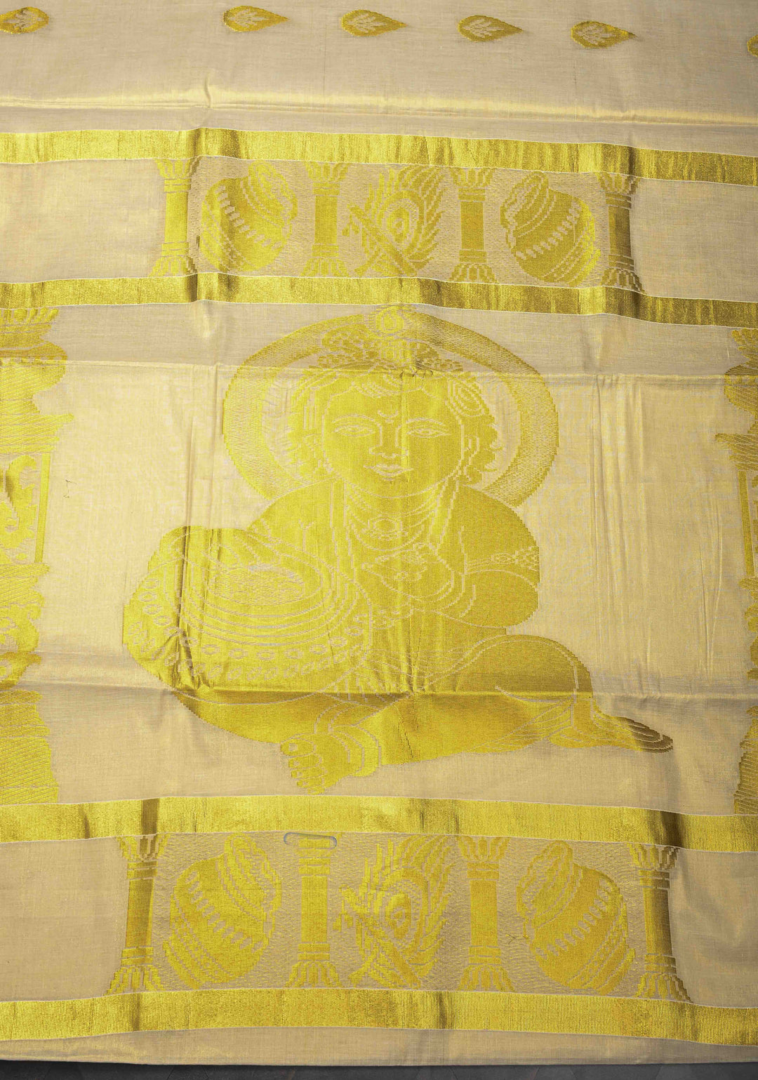 Unique Kerala Kasavu Saree in Tissue Cotton with Zari Buttas and Baby Krishna Theme on Pallu