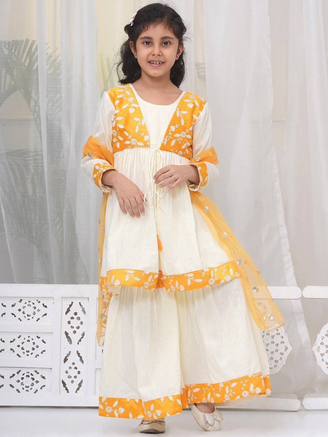 Girls Cotton Three Fourth Sleeves Frock Style Kurta with Sharara and Dupatta with Floral Thread Embroidery & Tussel Work - Cream | SHOBITAM  |