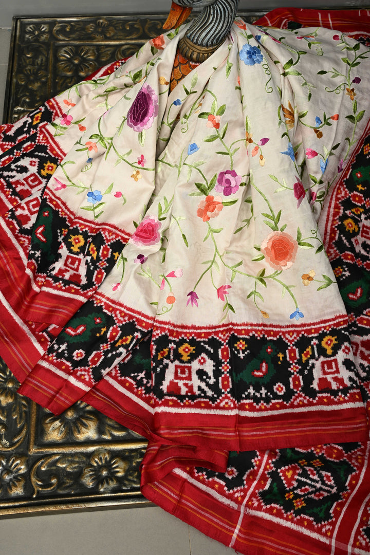Ivory Jugalbandi Authentic Patan Patola Double Ikkat Pure Silk Saree With Parsi Gara Hand Embroidery Floral Jaal and Contrst Black Pallu on Both Side | SILK MARK CERTIFIED | SHOBITAM