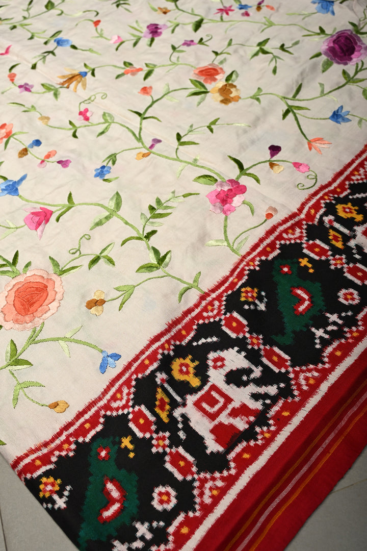 Ivory Jugalbandi Authentic Patan Patola Double Ikkat Pure Silk Saree With Parsi Gara Hand Embroidery Floral Jaal and Contrst Black Pallu on Both Side | SILK MARK CERTIFIED | SHOBITAM