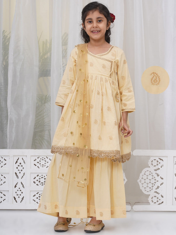 Girls Cotton Three Fourth Sleeves Angrakha Kurta with Sharara and Net Dupatta with Paisley Design Zari Work- Dutch Cream | SHOBITAM