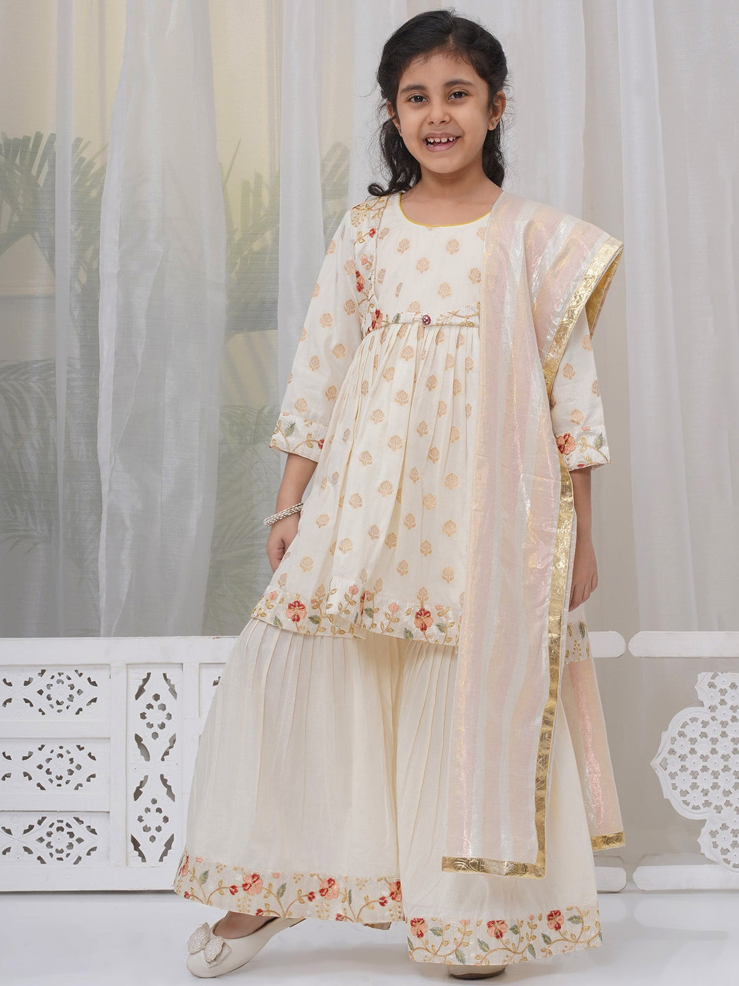 Girls Cotton Three Fourth Sleeves Frock Kurta with Sharara and Dupatta with Floral Embroidery & Zari Work - Cream | SHOBITAM