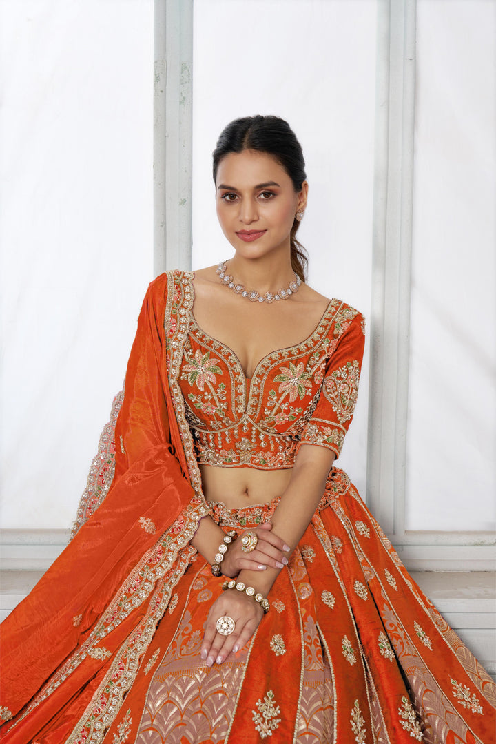 Elegant Rust Lehenga Featuring Rich Raw Silk and Artisan Craftsmanship | SHOBITAM