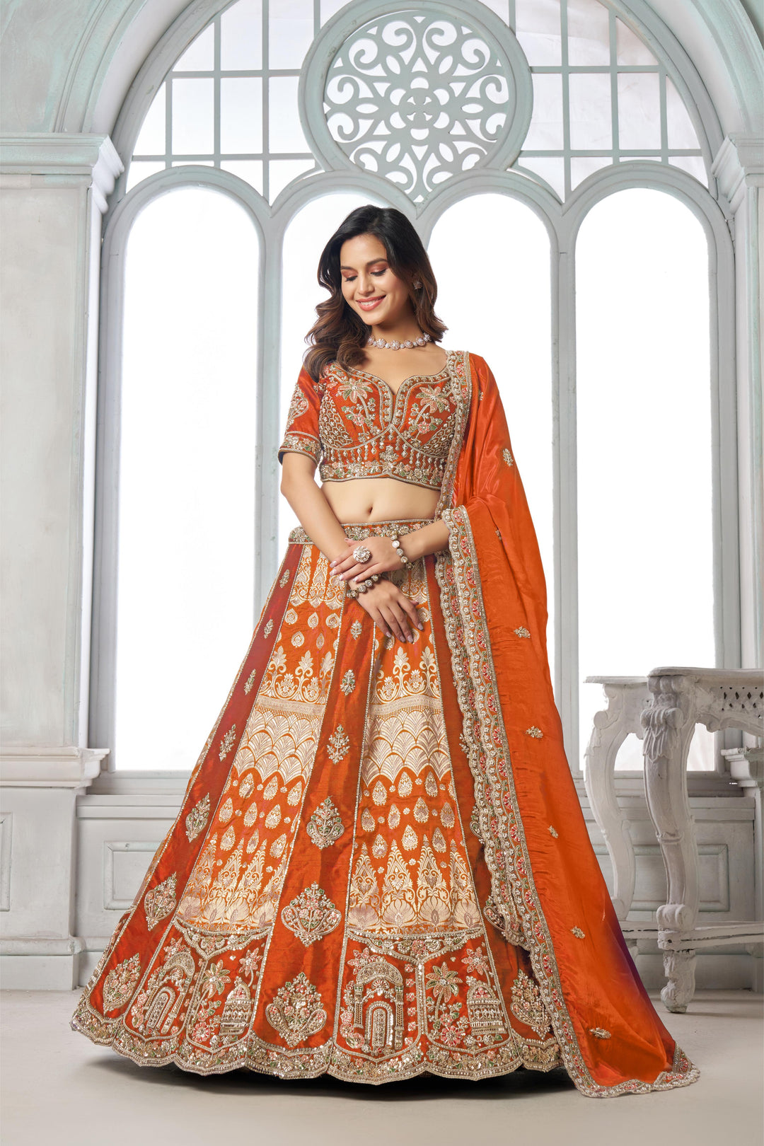 Elegant Rust Lehenga Featuring Rich Raw Silk and Artisan Craftsmanship | SHOBITAM