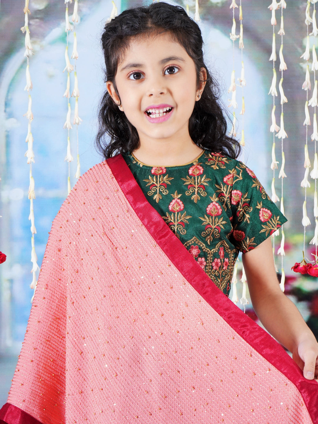 Girl Bageecha Floral Thread work Blouse with Velvet Lehenga and Sequin moti work Dupatta, accompanied with Hand made tassel and Ghungroo work in Green | SHOBITAM