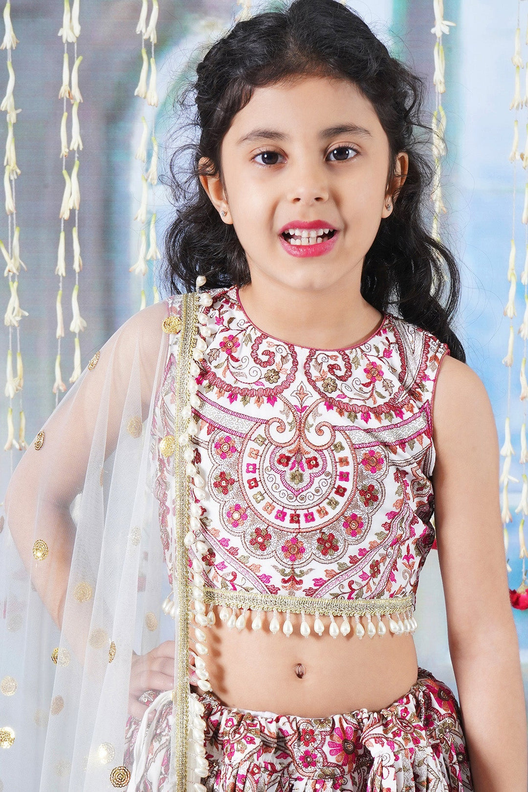 Girls Multi color Mughal Pattern Floral Thread work Cream Lehenga with Blouse and Dupatta with Pearl Detailing and Hand made Tassel | SHOBITAM