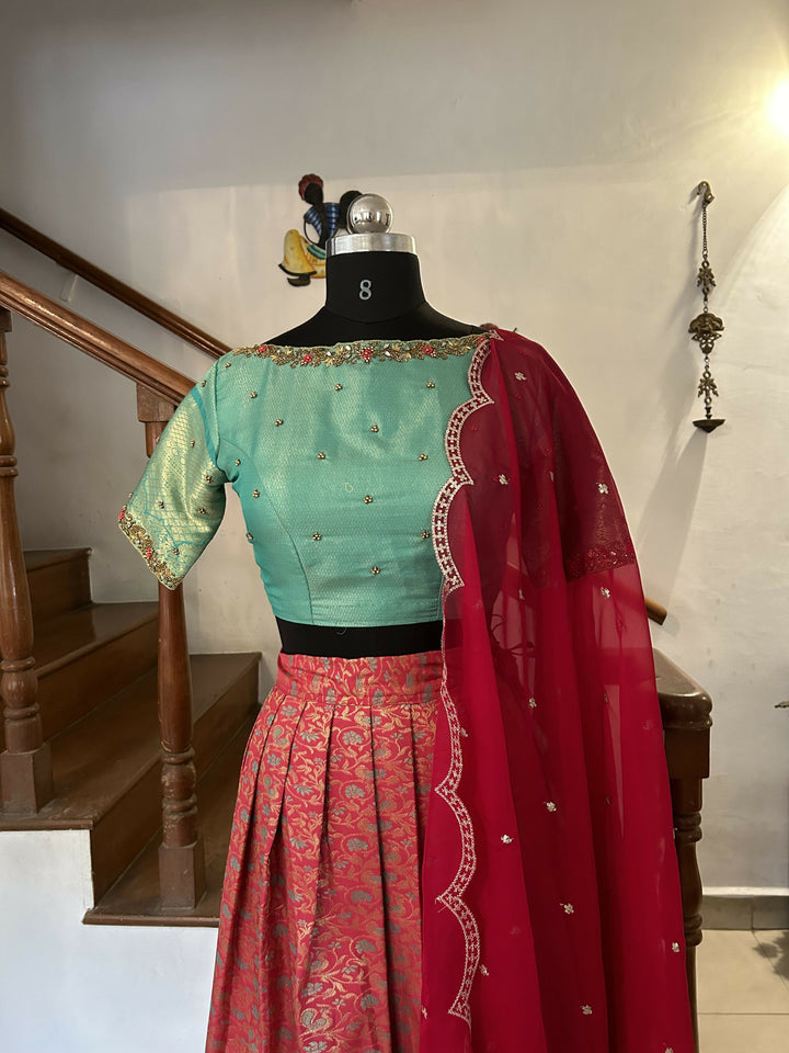 Tomato Red jacquard sea blue semi Kanchi lehenga | SHOBITAM