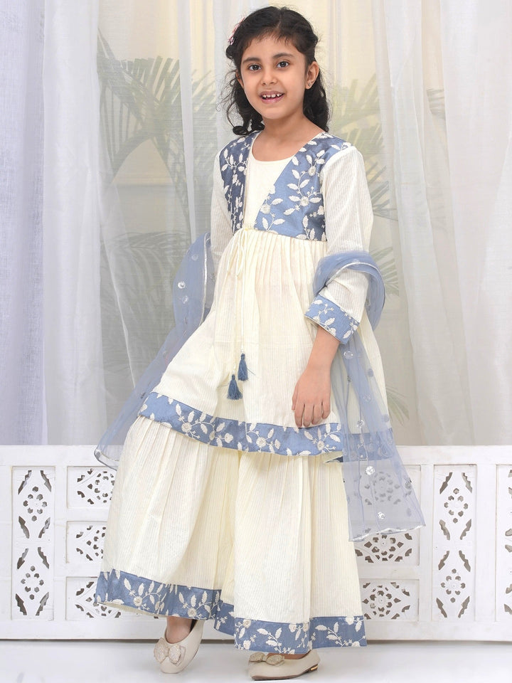 Girls Cotton Three Fourth Sleeves Frock Style Kurta with Sharara and Dupatta with Floral Thread Embroidery & Tussel Work - Cream | SHOBITAM