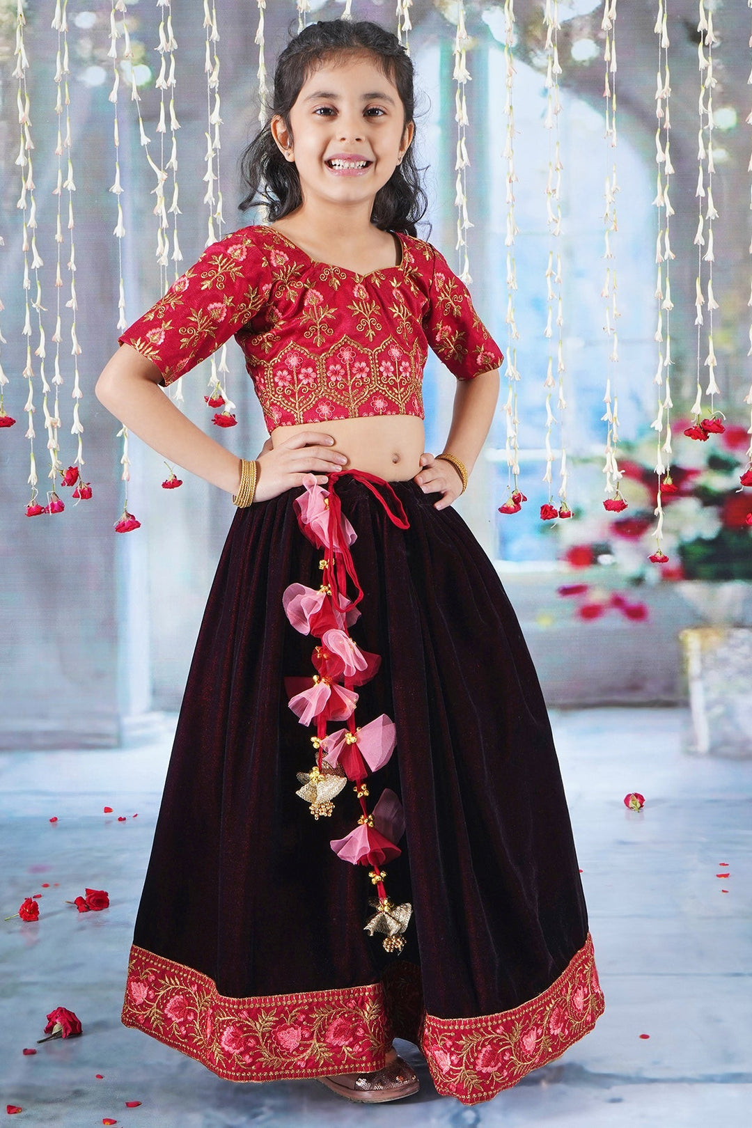 Girl Bageecha Floral Thread work Blouse with Velvet Lehenga and Sequin moti work Dupatta, accompanied with Hand made tassel and Ghungroo work in Cherry Red | SHOBITAM
