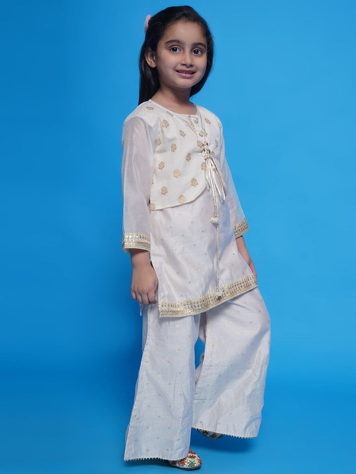 Girls Chanderi Cotton Three Fourth Sleeves Kurta with Attached Floral Jacket and Plazzo with Dupatta Adorned by Lace & Tussel work - Cream | SHOBITAM