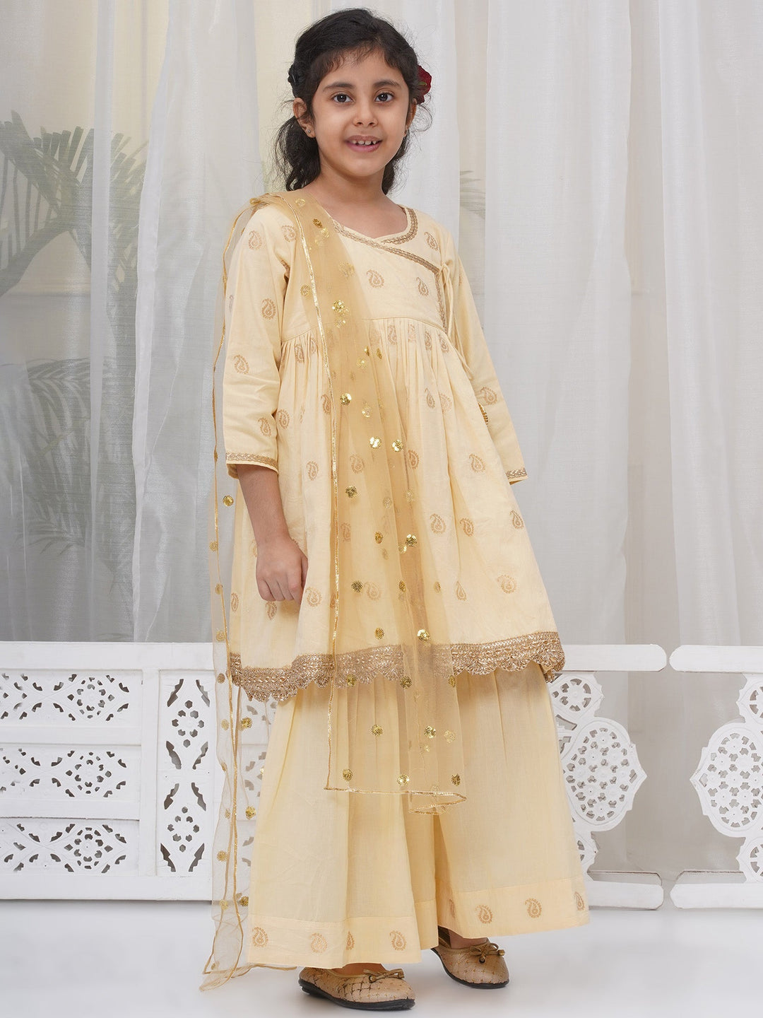Girls Cotton Three Fourth Sleeves Angrakha Kurta with Sharara and Net Dupatta with Paisley Design Zari Work- Dutch Cream | SHOBITAM