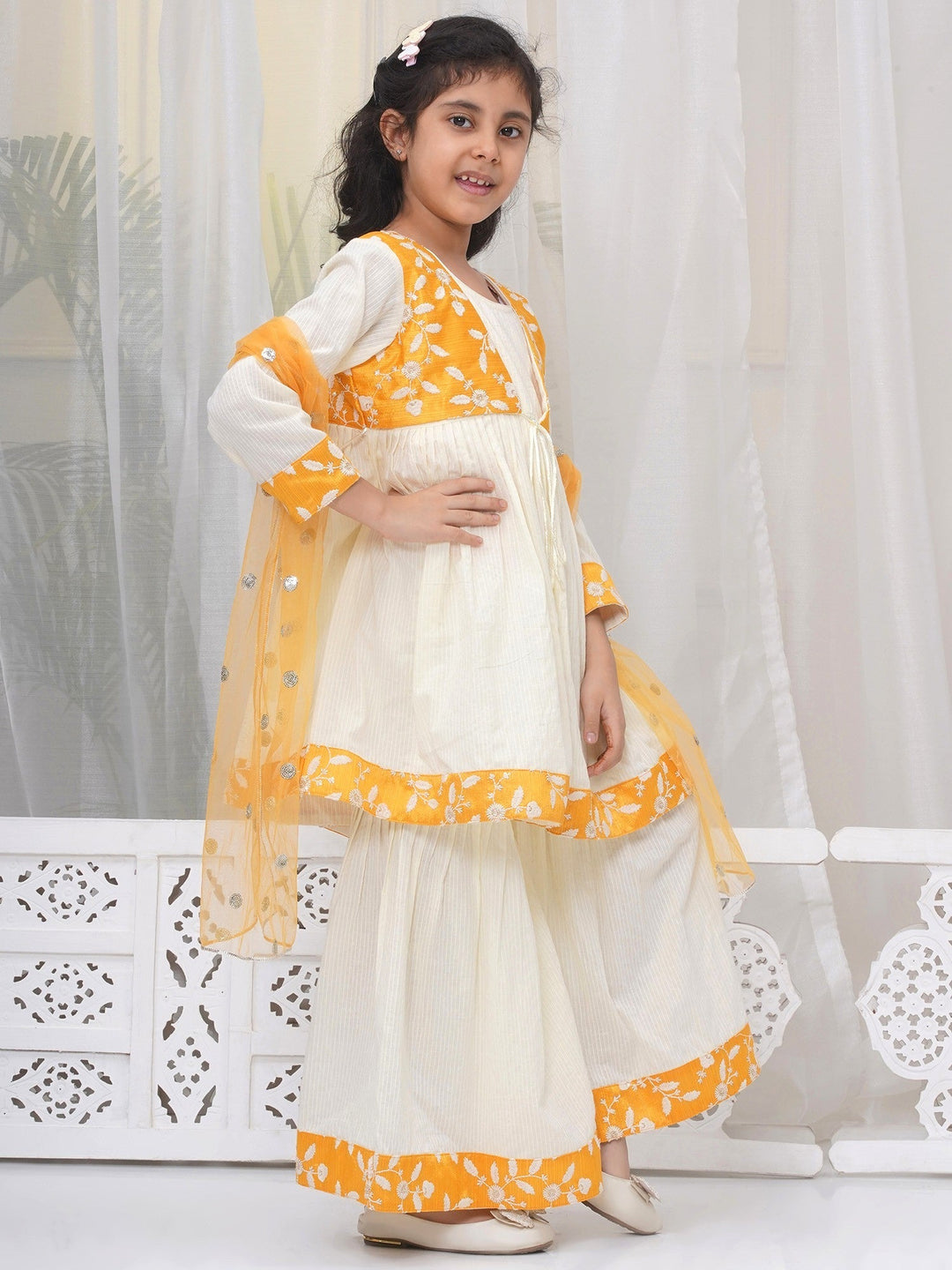 Girls Cotton Three Fourth Sleeves Frock Style Kurta with Sharara and Dupatta with Floral Thread Embroidery & Tussel Work - Cream | SHOBITAM  |
