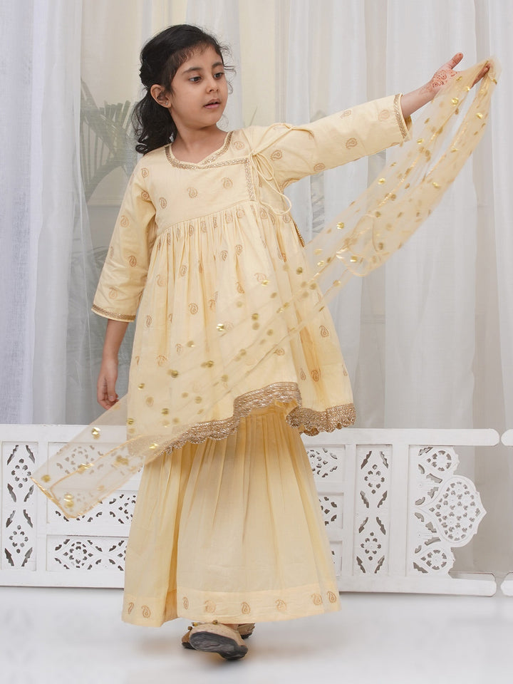 Girls Cotton Three Fourth Sleeves Angrakha Kurta with Sharara and Net Dupatta with Paisley Design Zari Work- Dutch Cream | SHOBITAM