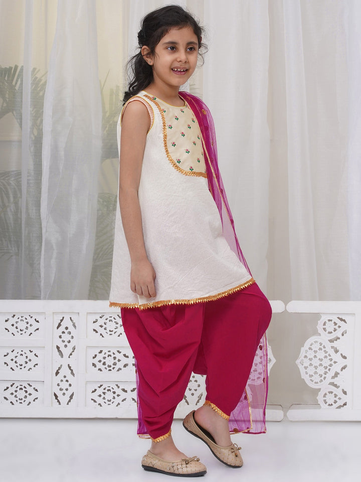 Girls Cotton Sleeveless Kurta with Dhoti Salwar and Dupatta with Floral Embroidery - Cream | SHOBITAM