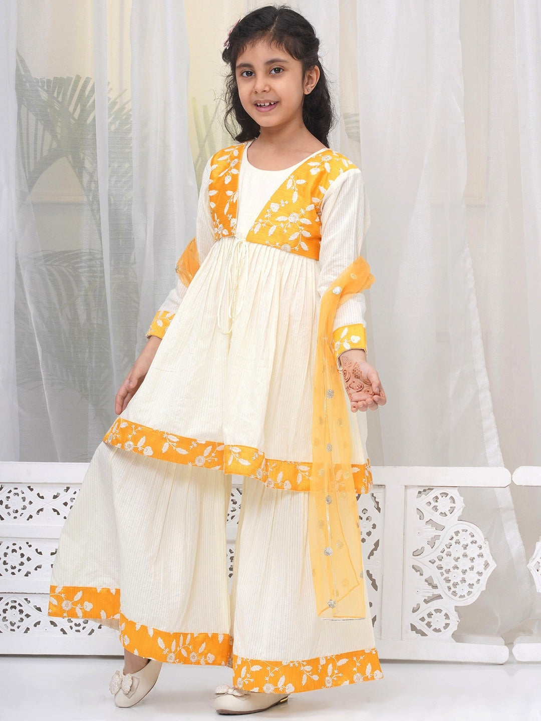 Girls Cotton Three Fourth Sleeves Frock Style Kurta with Sharara and Dupatta with Floral Thread Embroidery & Tussel Work - Cream | SHOBITAM  |