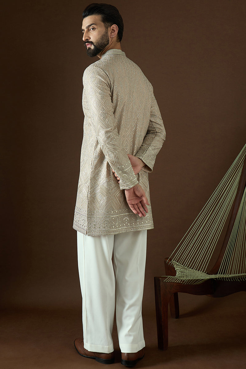 Beige Gerogrtte Solid Embroidered Straight Kurta | SHOBITAM