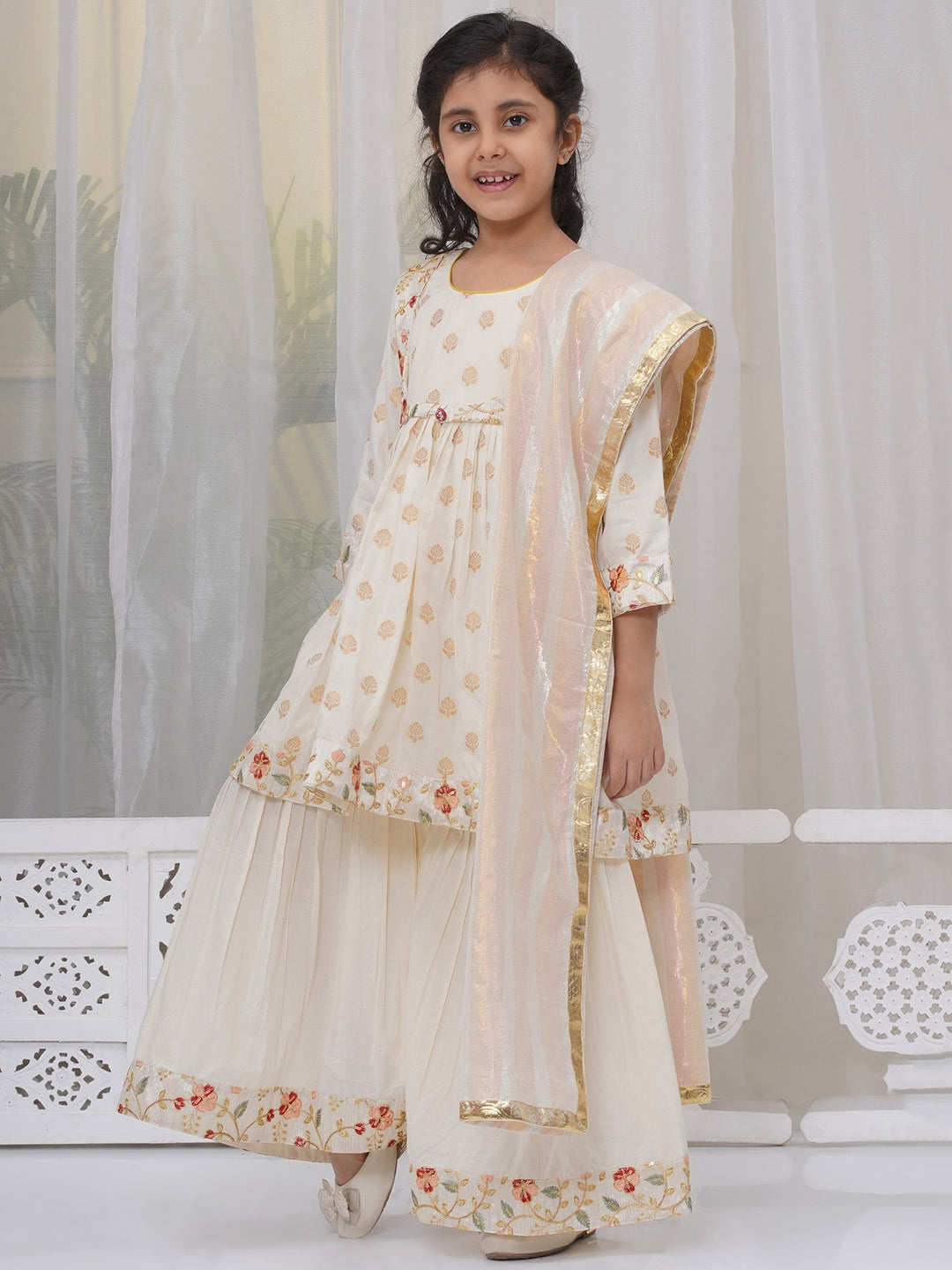 Girls Cotton Three Fourth Sleeves Frock Kurta with Sharara and Dupatta with Floral Embroidery & Zari Work - Cream | SHOBITAM