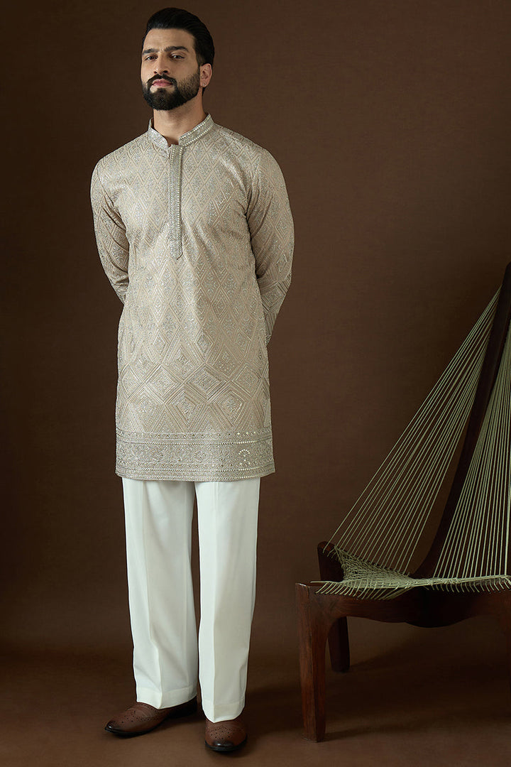 Beige Gerogrtte Solid Embroidered Straight Kurta | SHOBITAM