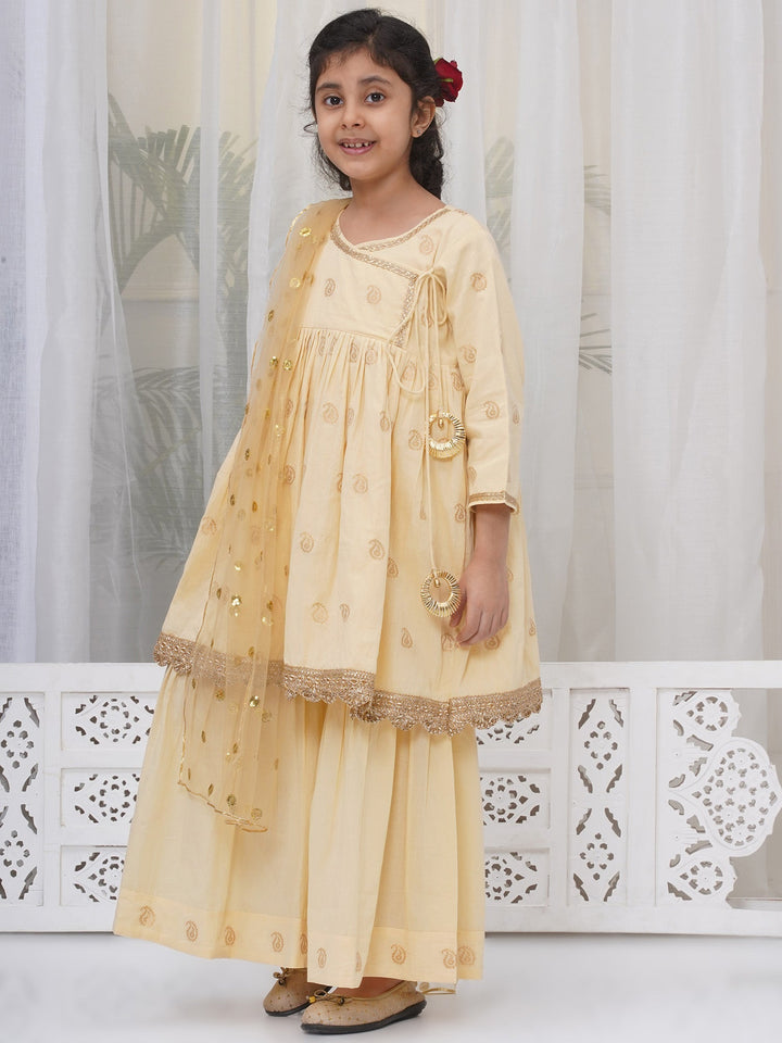 Girls Cotton Three Fourth Sleeves Angrakha Kurta with Sharara and Net Dupatta with Paisley Design Zari Work- Dutch Cream | SHOBITAM