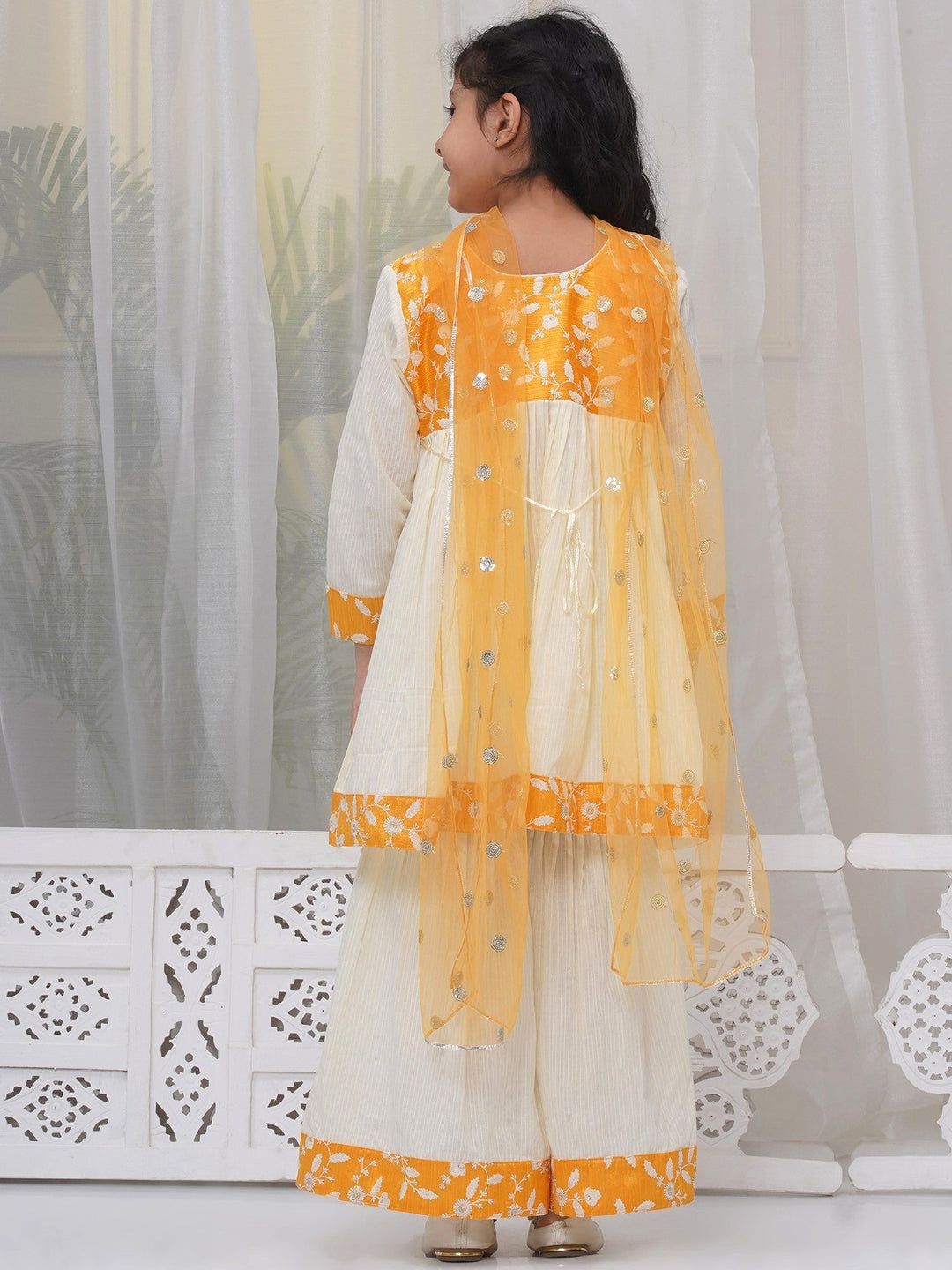 Girls Cotton Three Fourth Sleeves Frock Style Kurta with Sharara and Dupatta with Floral Thread Embroidery & Tussel Work - Cream | SHOBITAM  |