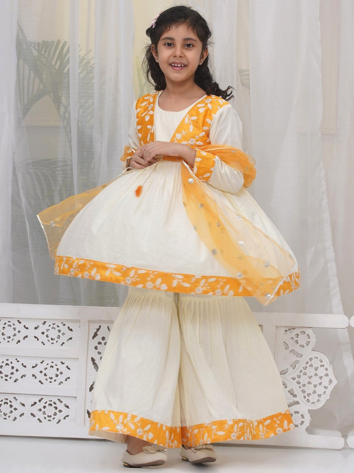 Girls Cotton Three Fourth Sleeves Frock Style Kurta with Sharara and Dupatta with Floral Thread Embroidery & Tussel Work - Cream | SHOBITAM  |