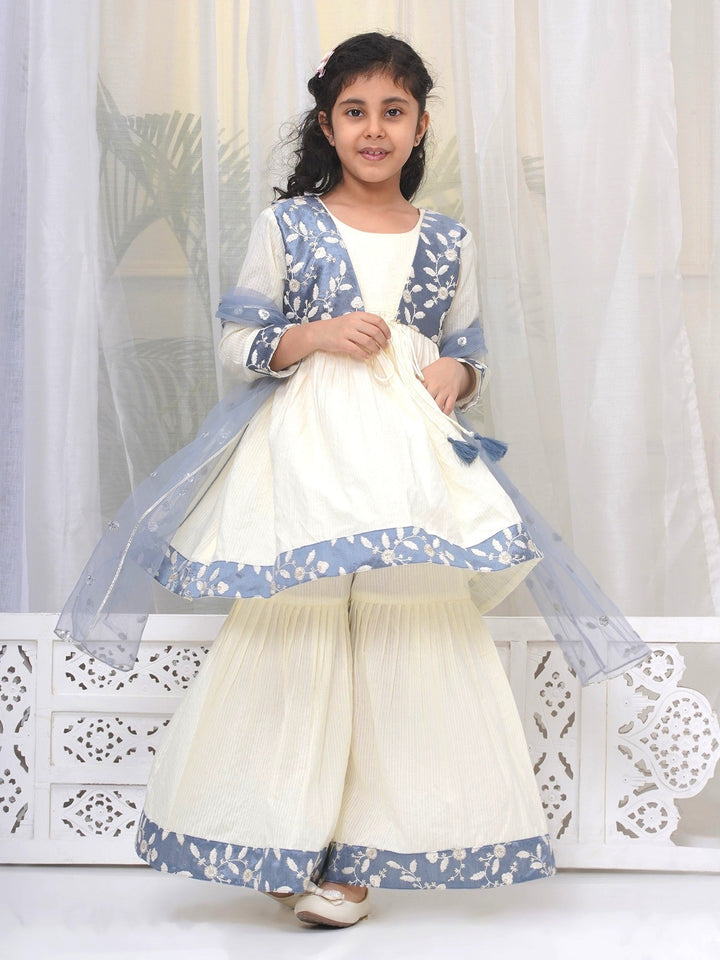Girls Cotton Three Fourth Sleeves Frock Style Kurta with Sharara and Dupatta with Floral Thread Embroidery & Tussel Work - Cream | SHOBITAM