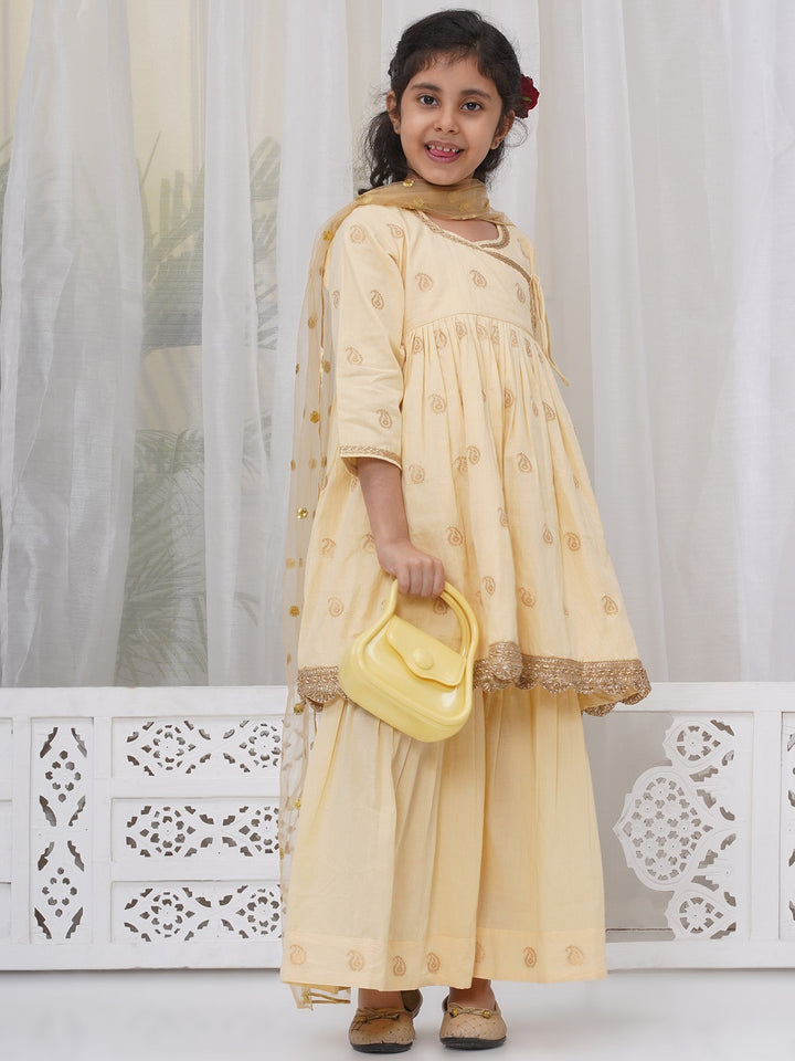 Girls Cotton Three Fourth Sleeves Angrakha Kurta with Sharara and Net Dupatta with Paisley Design Zari Work- Dutch Cream | SHOBITAM