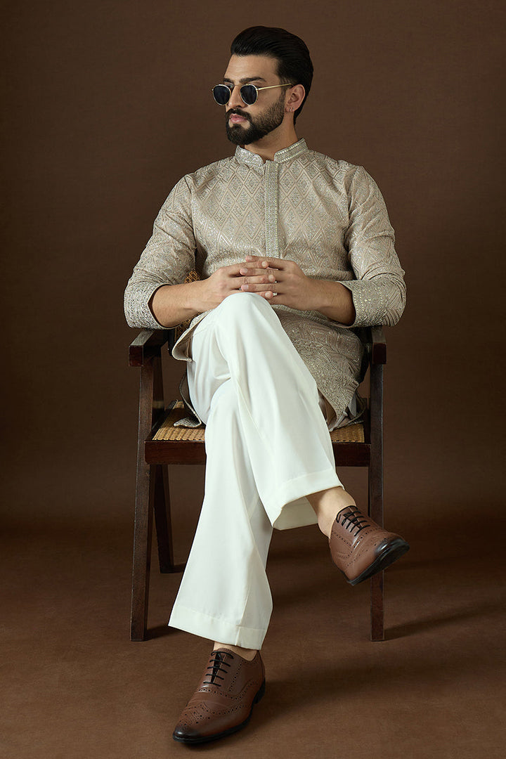 Beige Gerogrtte Solid Embroidered Straight Kurta | SHOBITAM
