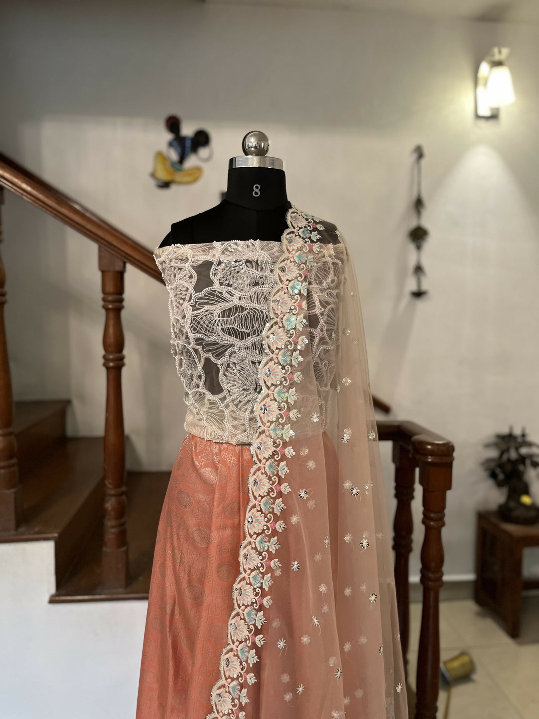 Un stitched peach jacquard skirt with a delicate blush pink net dupatta & sequence blouse | SHOBITAM