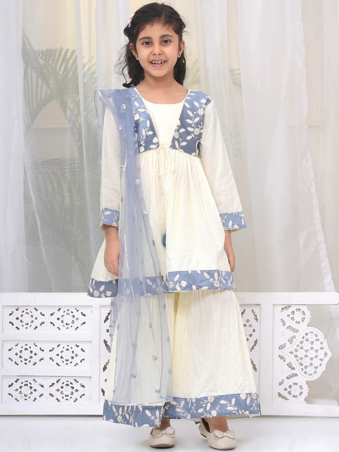 Girls Cotton Three Fourth Sleeves Frock Style Kurta with Sharara and Dupatta with Floral Thread Embroidery & Tussel Work - Cream | SHOBITAM