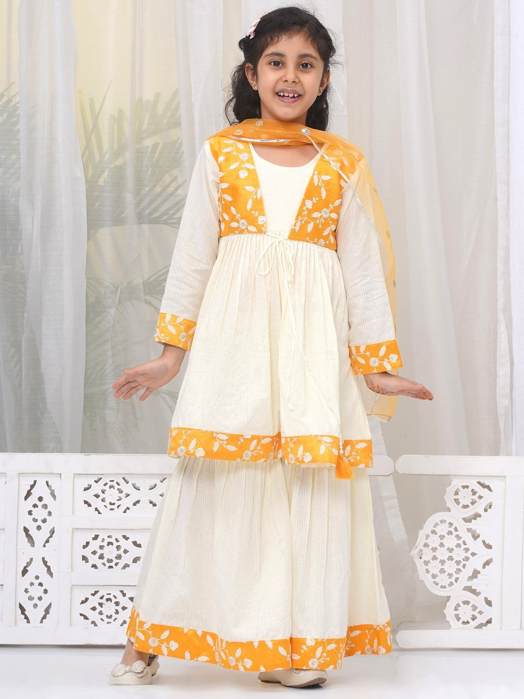 Girls Cotton Three Fourth Sleeves Frock Style Kurta with Sharara and Dupatta with Floral Thread Embroidery & Tussel Work - Cream | SHOBITAM  |