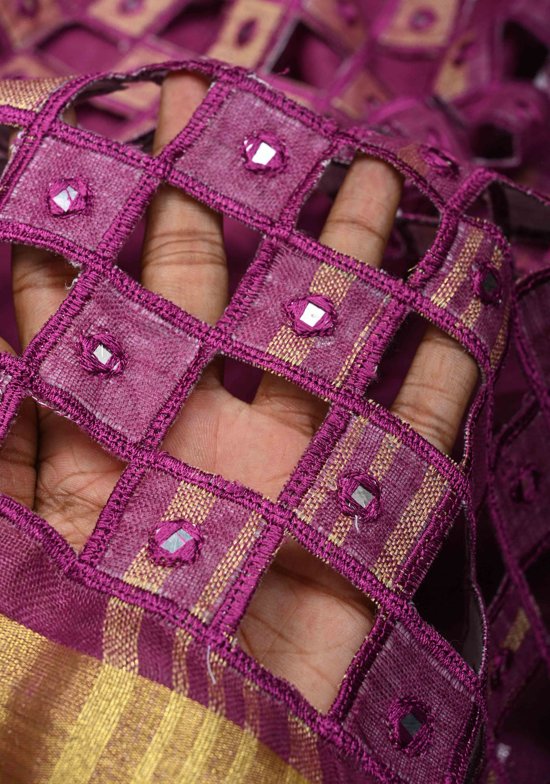 Magenta Cutwork and Mirror Work Tissue Linen Saree with dramatic tassels