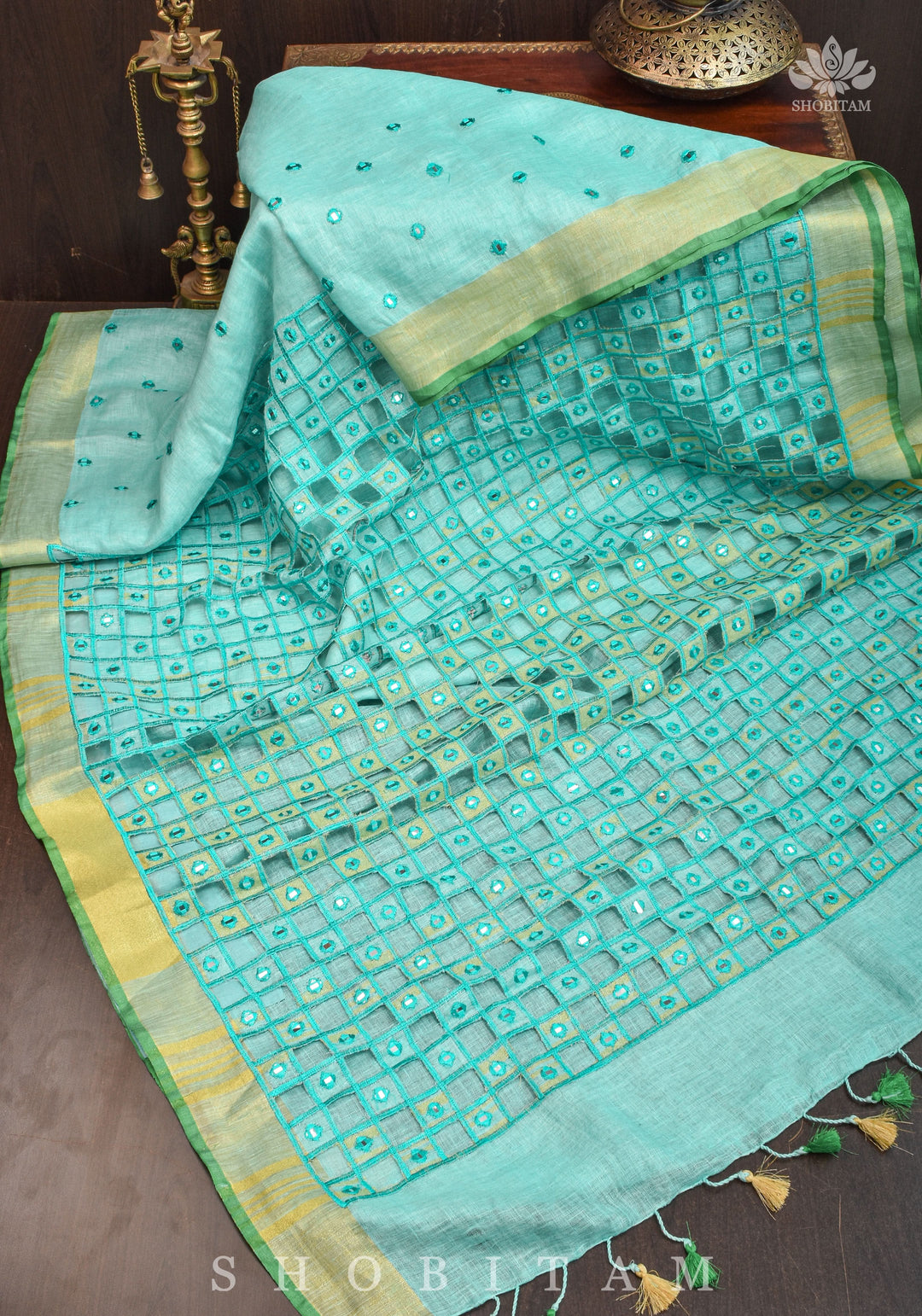 Jaali Pallu - Cutwork and Mirrorwork Saree in Linen by Linen in Teal Color | SHOBITAM