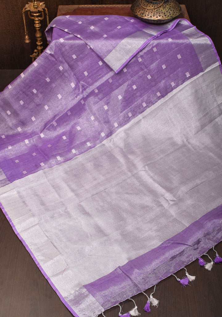 Lavender Hued Tissue Linen Saree with silver zari borders and long tassels!