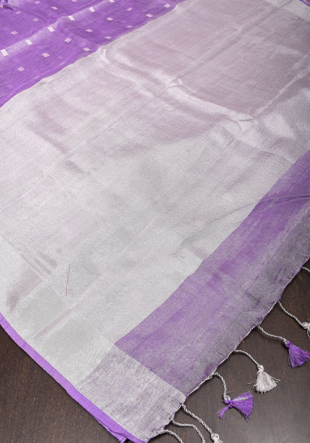 Lavender Hued Tissue Linen Saree with silver zari borders and long tassels!