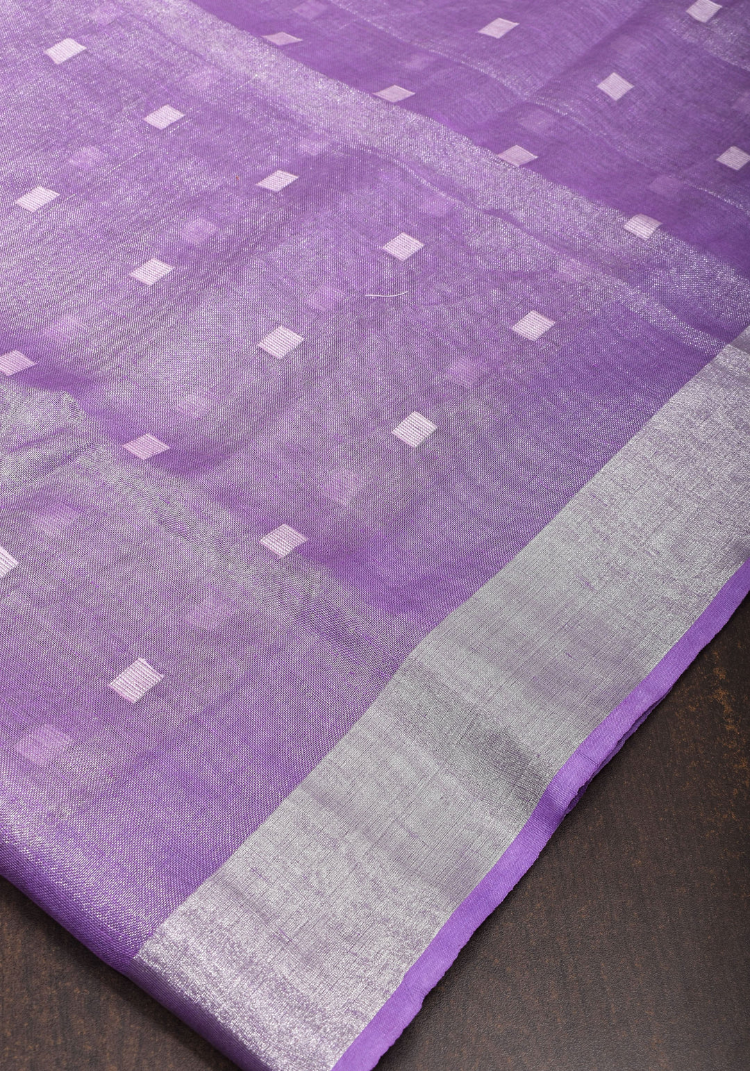 Lavender Hued Tissue Linen Saree with silver zari borders and long tassels!