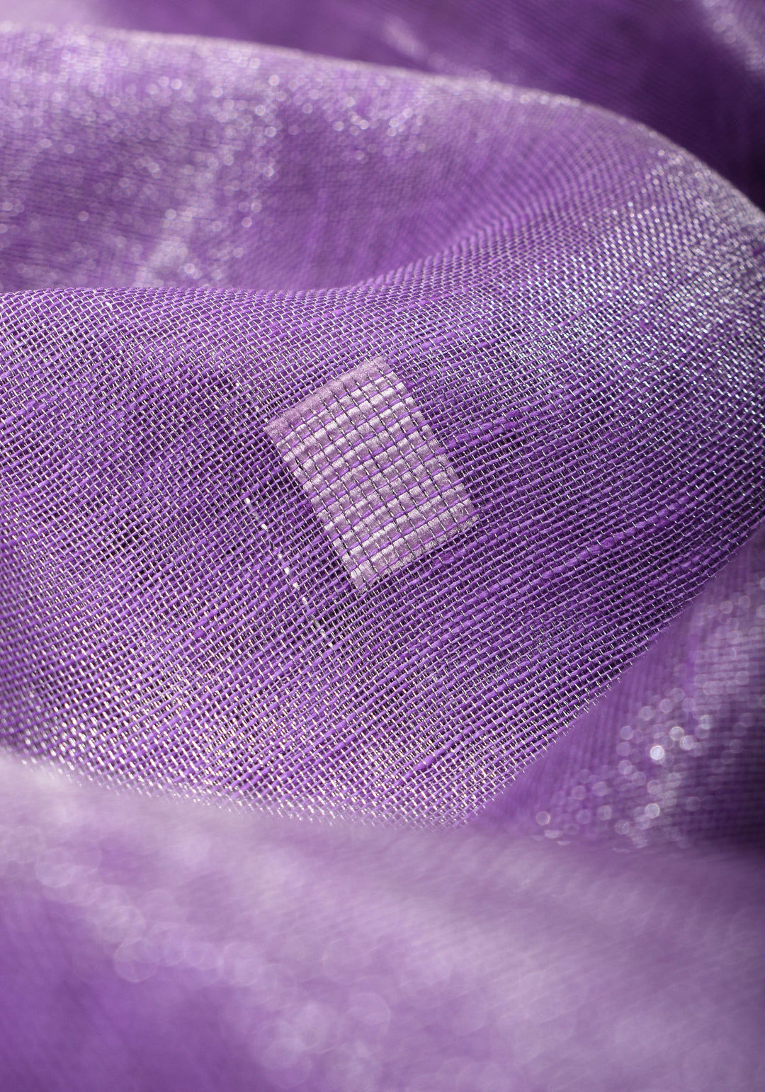 Lavender Hued Tissue Linen Saree with silver zari borders and long tassels!