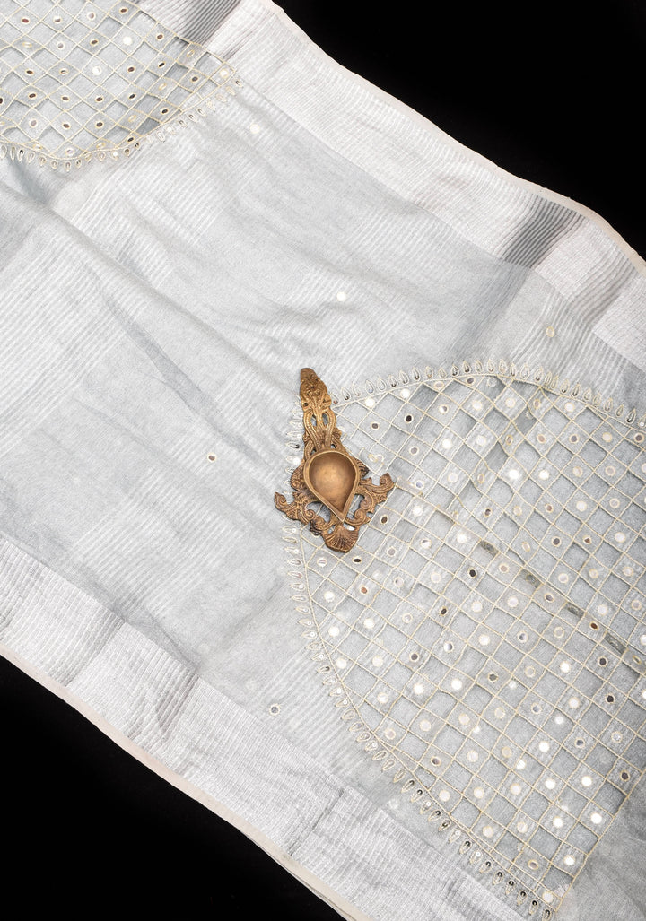 Cutwork and Mirror Work Tissue Linen Saree in White Silver with dramatic tassels