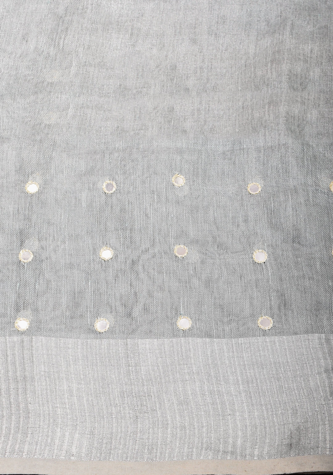 Cutwork and Mirror Work Tissue Linen Saree in White Silver with dramatic tassels