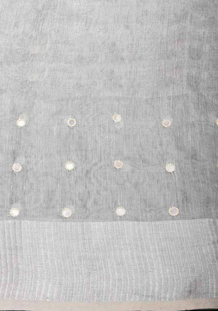 Cutwork and Mirror Work Tissue Linen Saree in White Silver with dramatic tassels